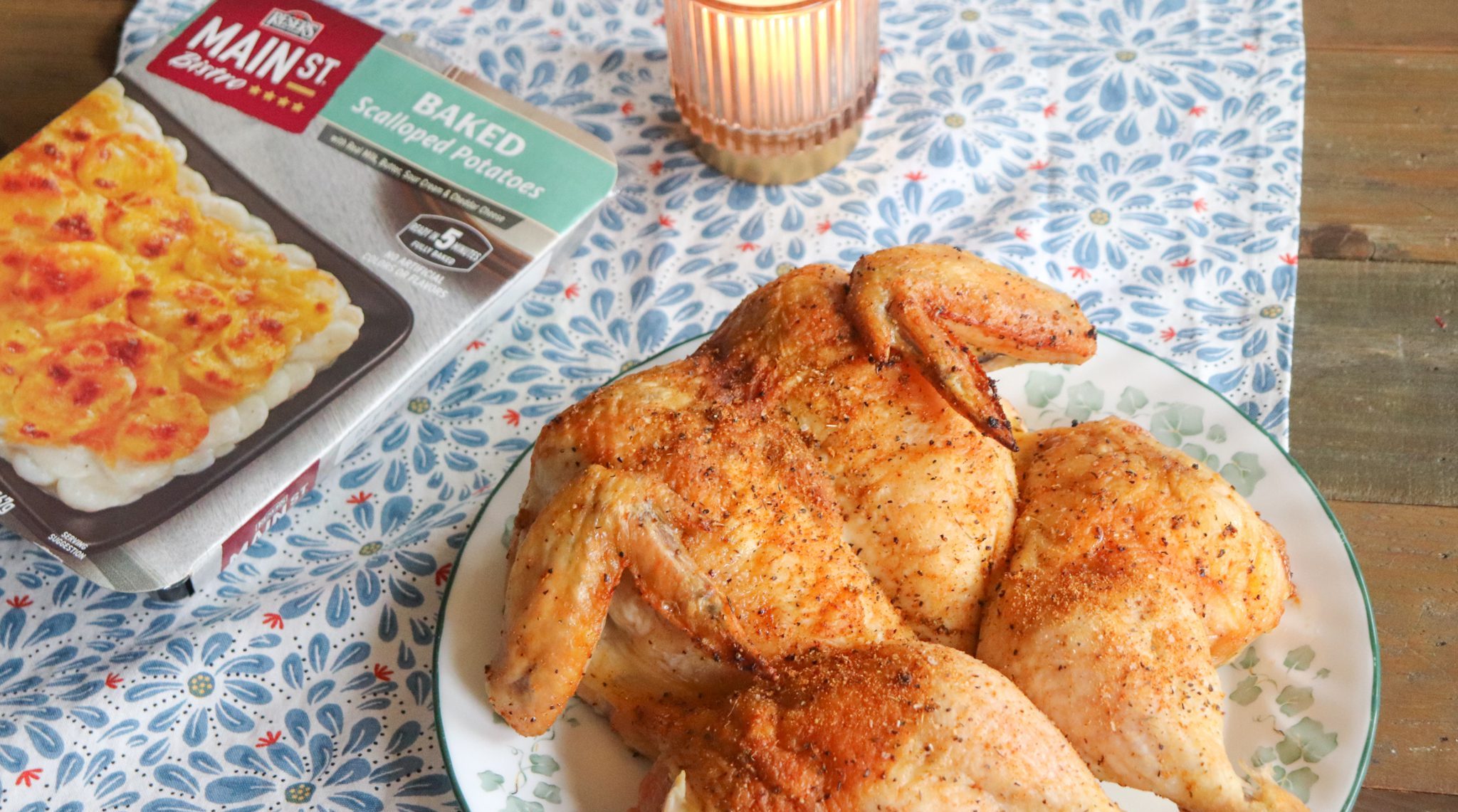 Main St Bistro scalloped potatoes on a table with a whole chicken